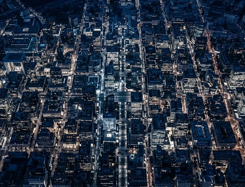 Aerial view of a modern European business district at blue hour
