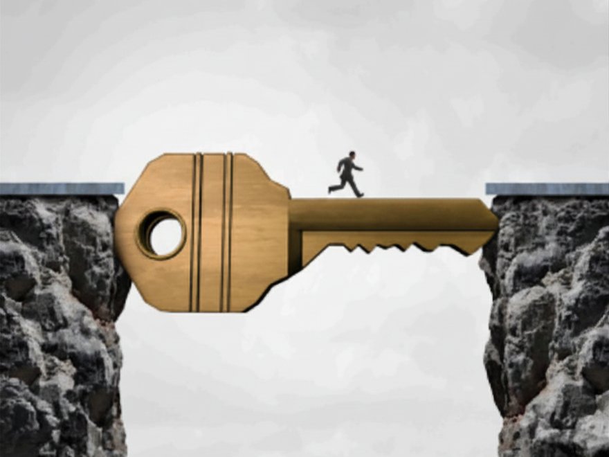 A golden key bridging two cliffs