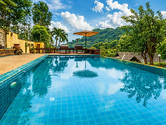 Infinity Saltwater Pool A peaceful pool surrounded by mountain greenery, ideal for swimming, sunbathing, and taking time to unwind.