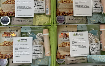 Healthy Snack Boxes free sampling box with honey roasted peanuts, shower steamers, protein bars and chocolate