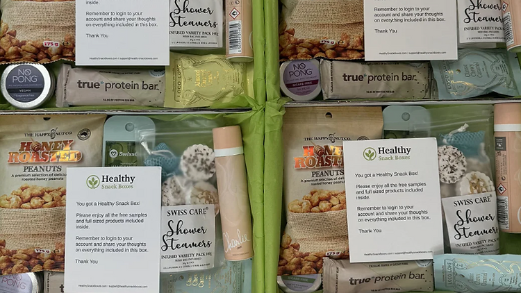 Healthy Snack Boxes free sampling box with honey roasted peanuts, shower steamers, protein bars and chocolate