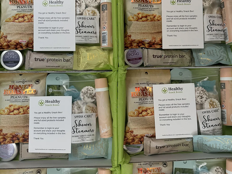 Healthy Snack Boxes free sampling box with honey roasted peanuts, shower steamers, protein bars and chocolate