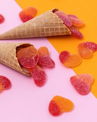 Sugar-coated heart gummies on cones