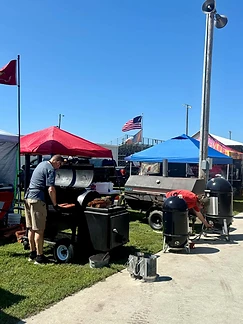 Pitmaster tending the fire