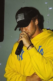 ZSZN performing into a handheld microphone