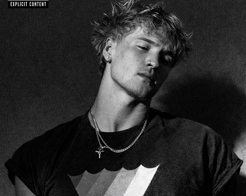 Portrait of the artist in dramatic high-contrast lighting