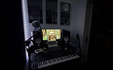 Control room desk, monitors, and MIDI keyboard