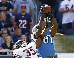 Football players catching pass
