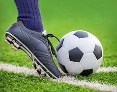 Soccer cleat striking ball