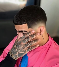 Textured forward fringe with mid skin fade connected to a full beard