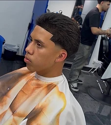 Textured top with sharp geometric line-up and taper fade