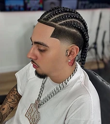 Cornrow braids on top with precise skin fade and sharp line-up