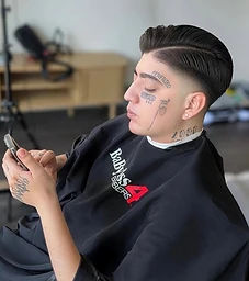 Slicked-back taper fade with crisp line-up