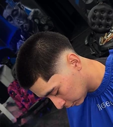 Skin-fade profile with sharp temple line-up