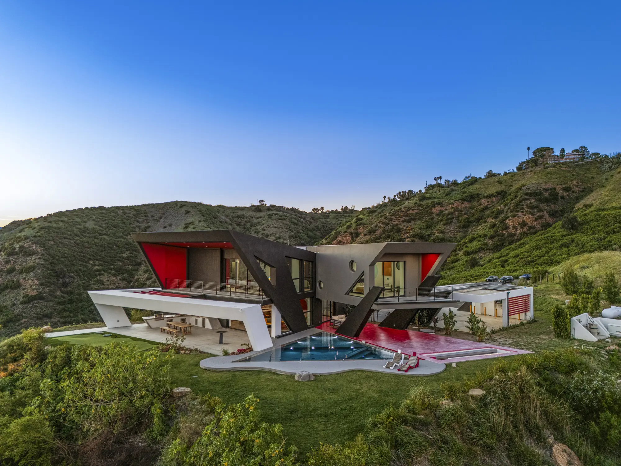 The Aviator residence and pool at sunset in the Malibu mountains