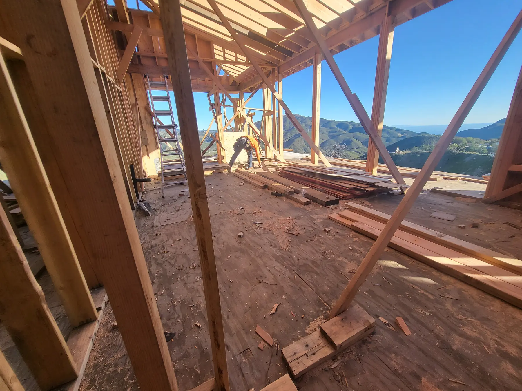 Roof framing open to the ocean view at Oya