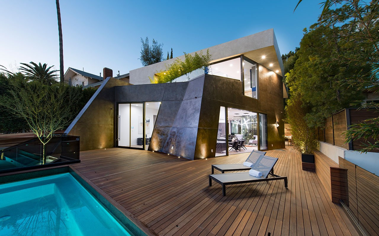 Dusk view of the pool deck and faceted volume at Shoreham, by Apel Design
