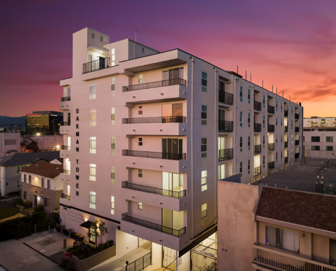 Bakman Housing at dusk, an affordable housing building by Apel Design in the San Fernando Valley