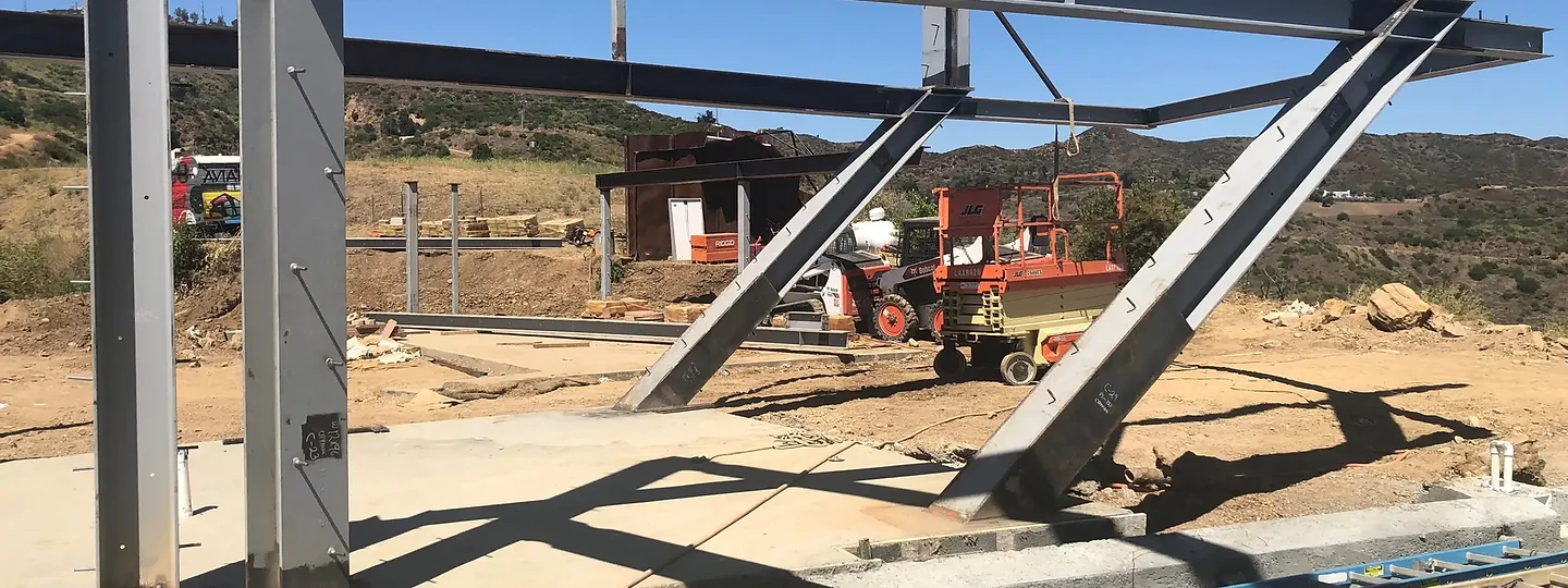 Structural steel frame of The Aviator on its hillside pad