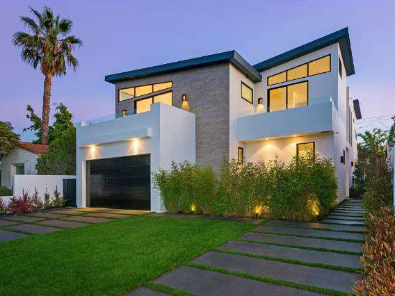 Maryland, a home by Apel Design in Beverly Grove at dusk
