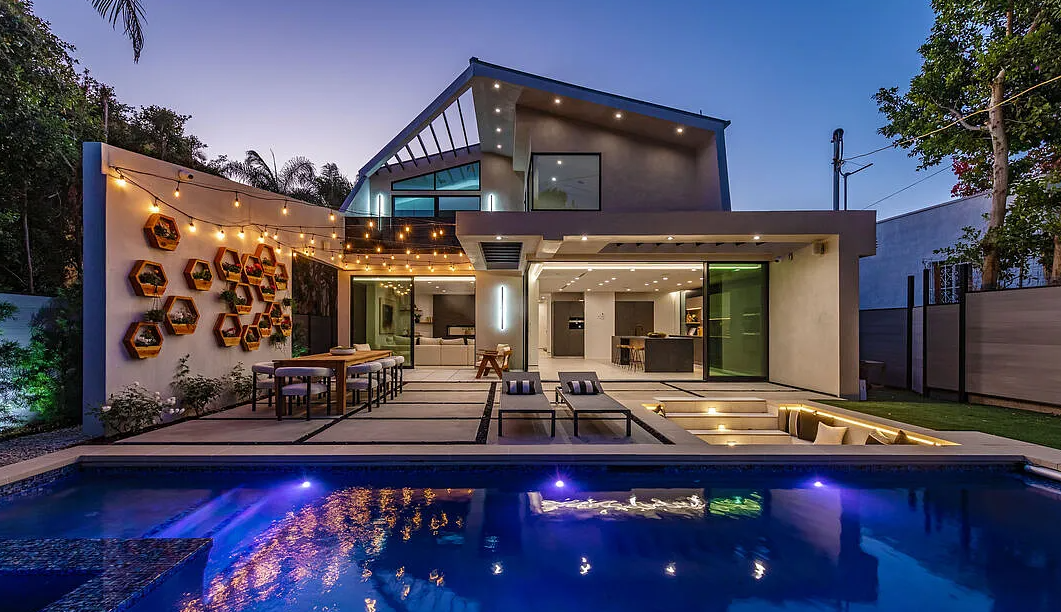 La Jolla North, a modern home in West Hollywood by Apel Design, with its pool and garden terrace at dusk