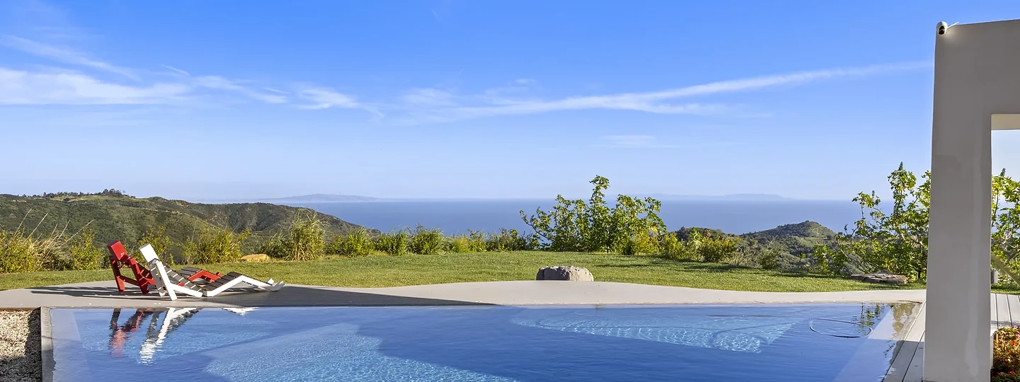 Pool and garden framed by a Southern California residence