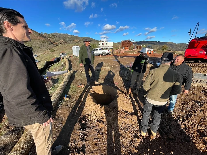 The team reviewing a drilled pier on site