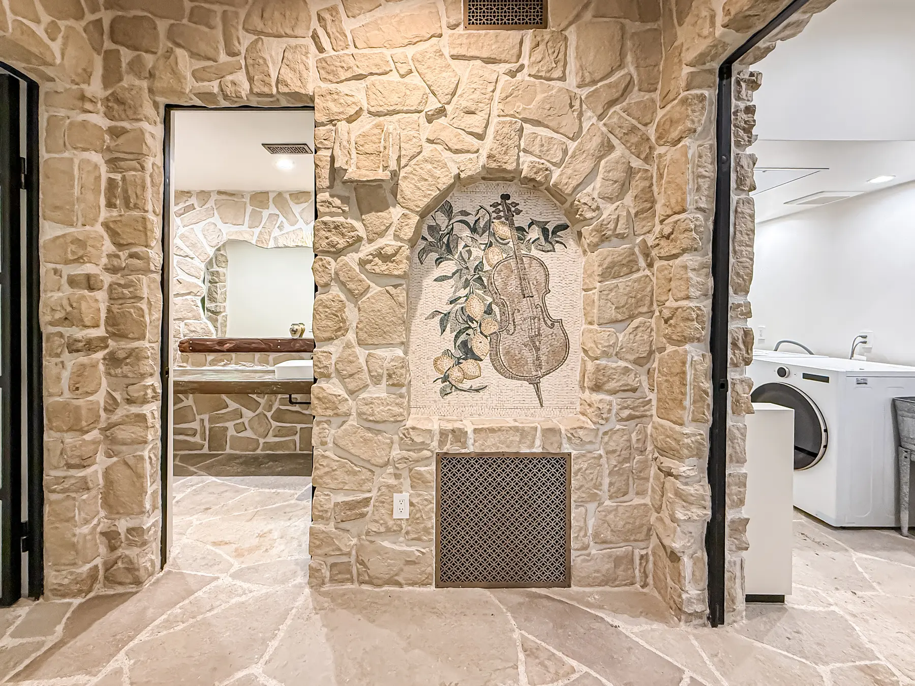 Carved niche set into a stone wall, at Mintcello in Malibu, by Apel Design