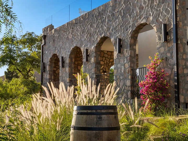 Stone arcade and planting on the exterior at Maliview