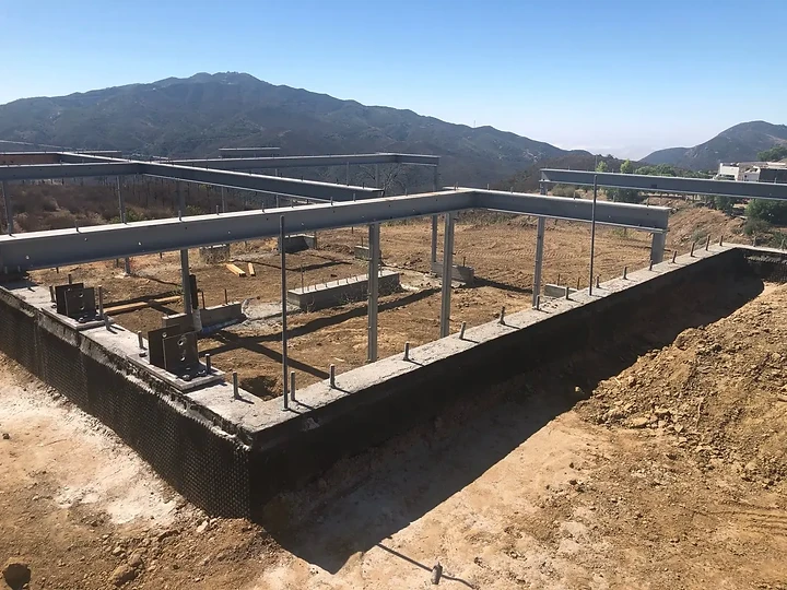 Steel moment frame set on the foundation at Oya