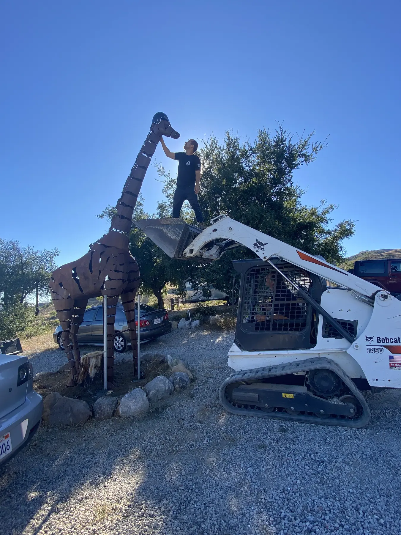 Installing a large sculptural piece on the Apel Design property