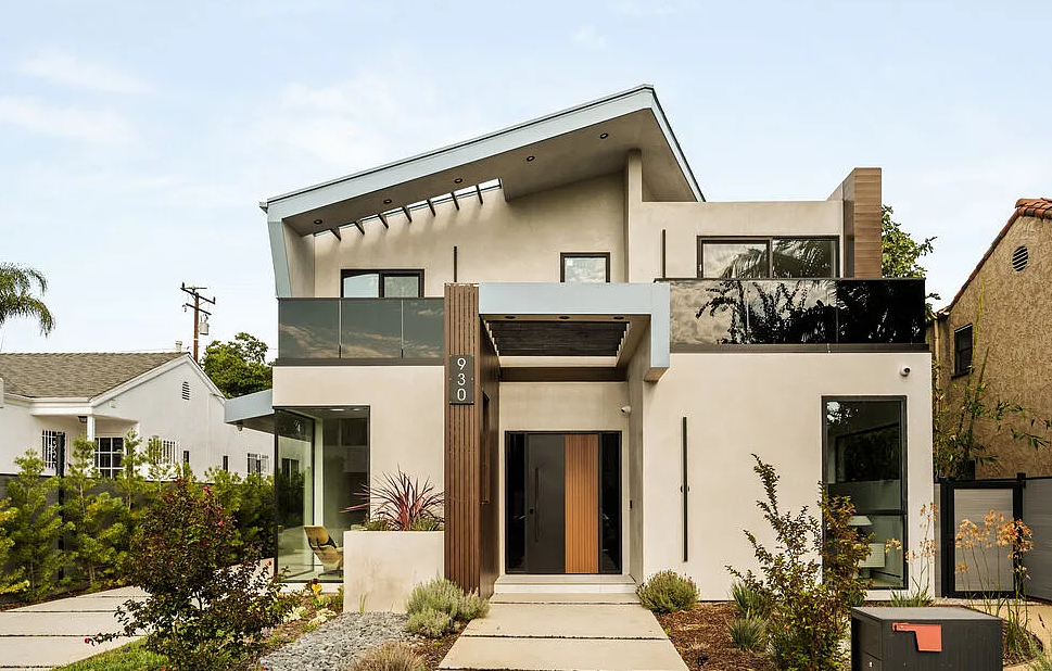 The street front, with the raked roof over the upper floor and the timber-slat entry, La Jolla North in West Hollywood by Apel Design