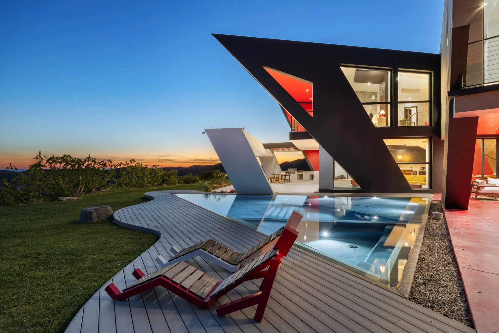 The Aviator, a sculptural Apel Design residence and pool at sunset in Malibu
