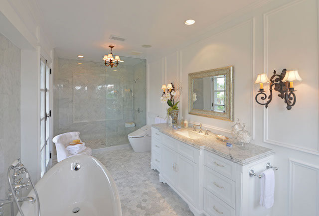 Bathroom at June in white marble, with a freestanding tub, by Apel Design