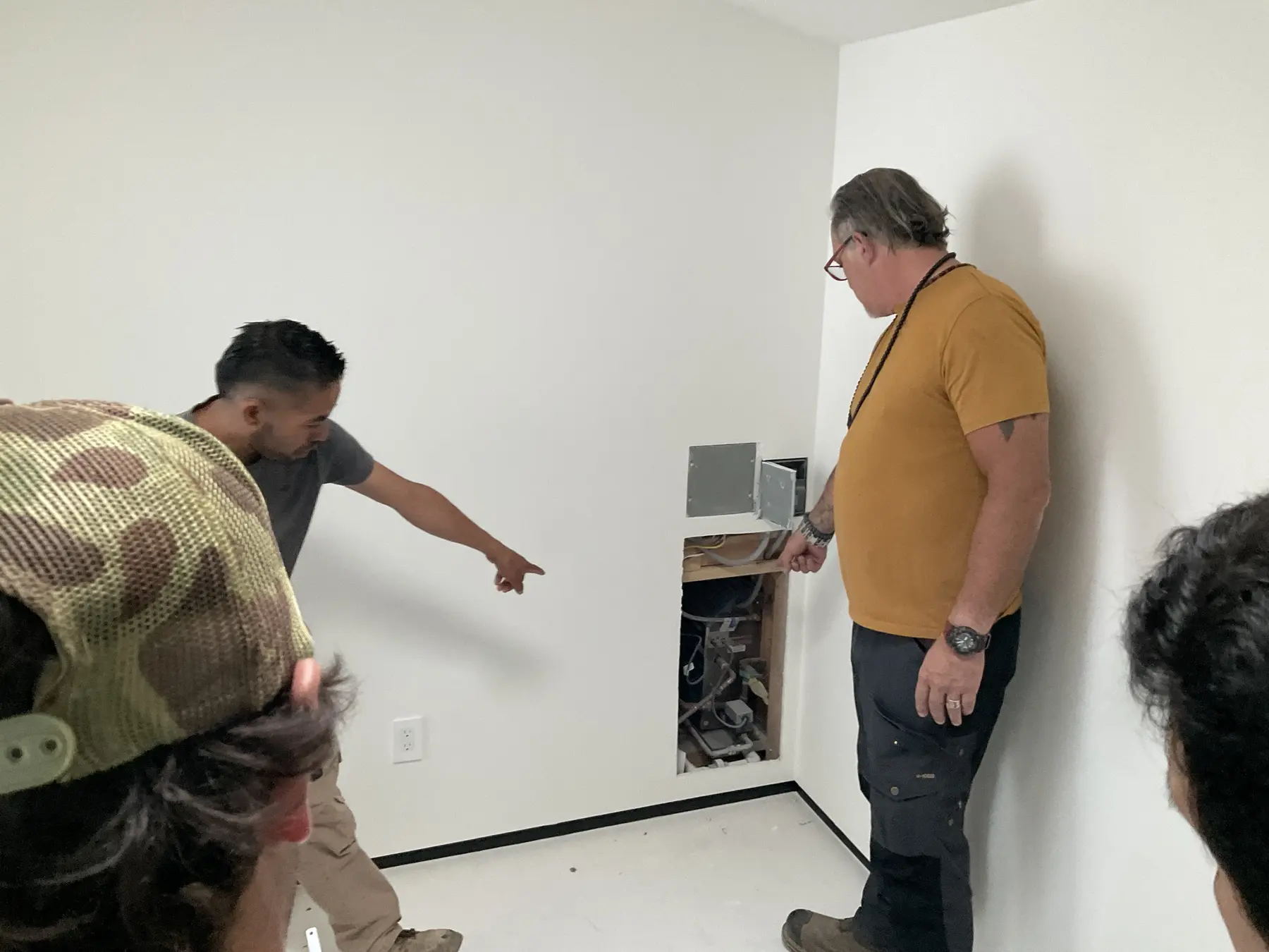 Reviewing a wall opening during construction on an Apel Design project