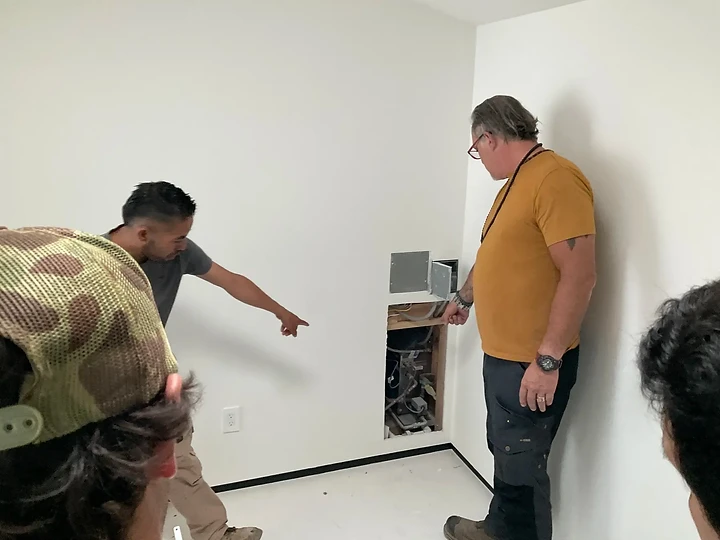 Reviewing a wall opening during construction on an Apel Design project