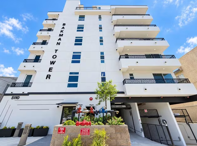 Street front of Bakman Housing by day, by Apel Design