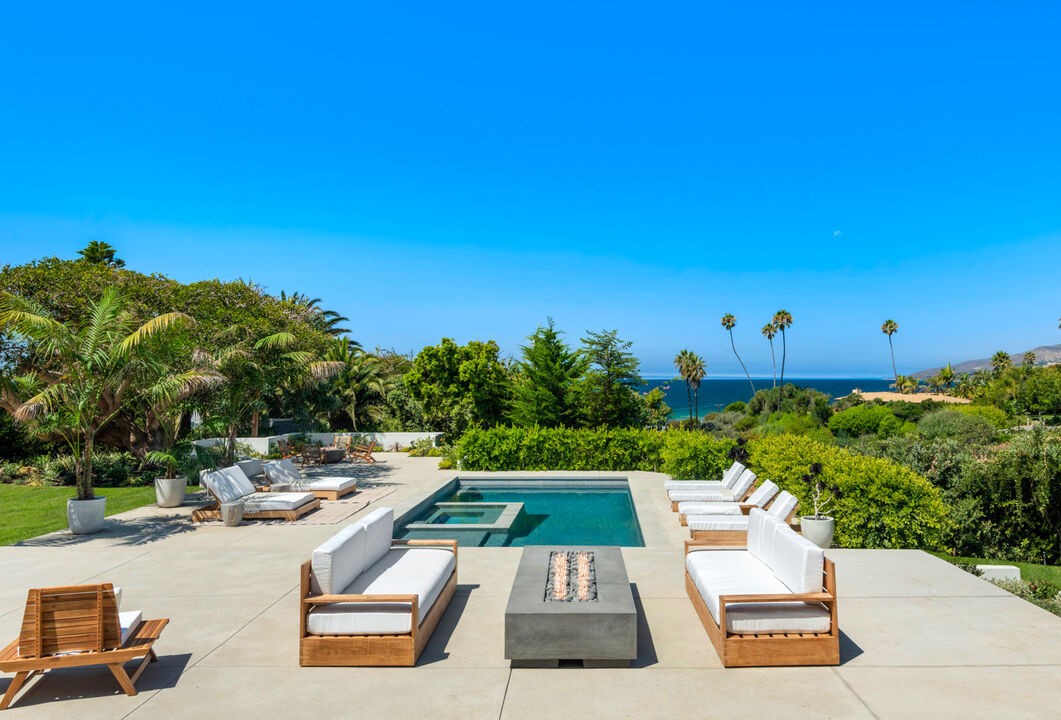 Pool terrace and ocean view at a Malibu residence by Apel Design