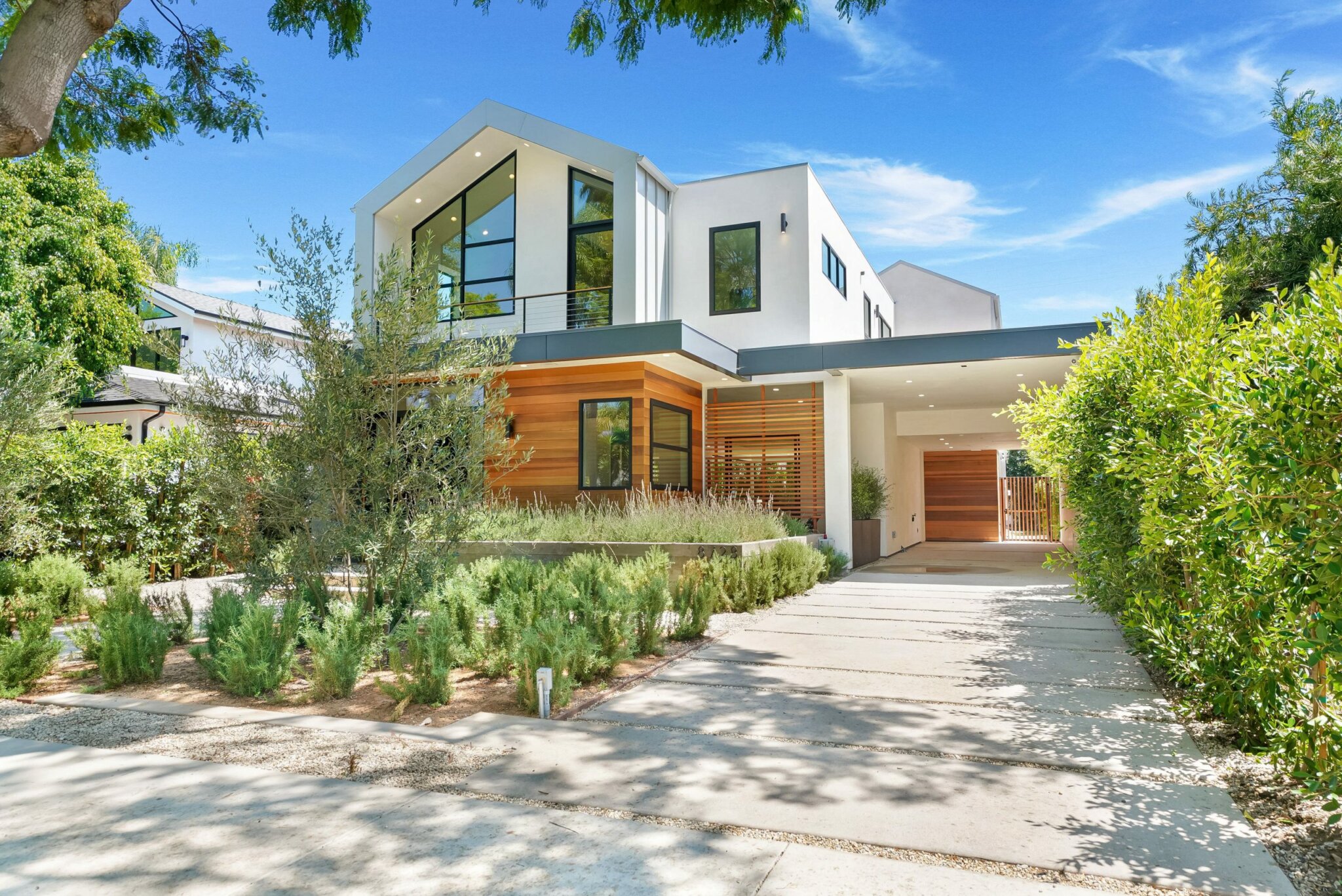 Street elevation at Ashcroft, with the cedar screen beside the entry, by Apel Design