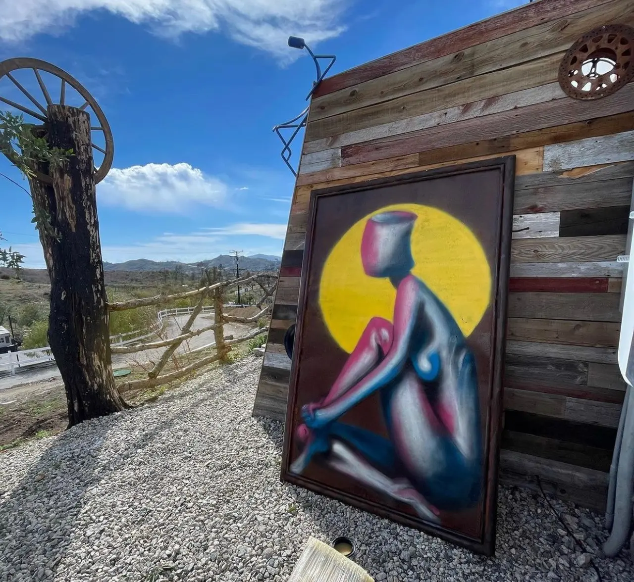 Original artwork by Amit Apel displayed outside the studio