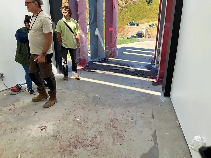 The team walking a residence during finish work