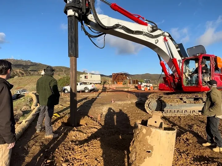 The Apel Design team watching a pier being drilled on site
