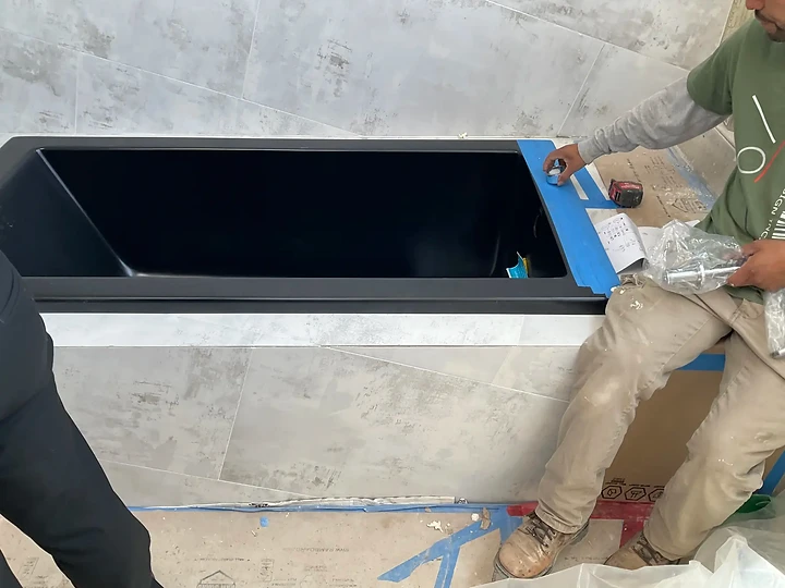 Setting a cast basin during finish work