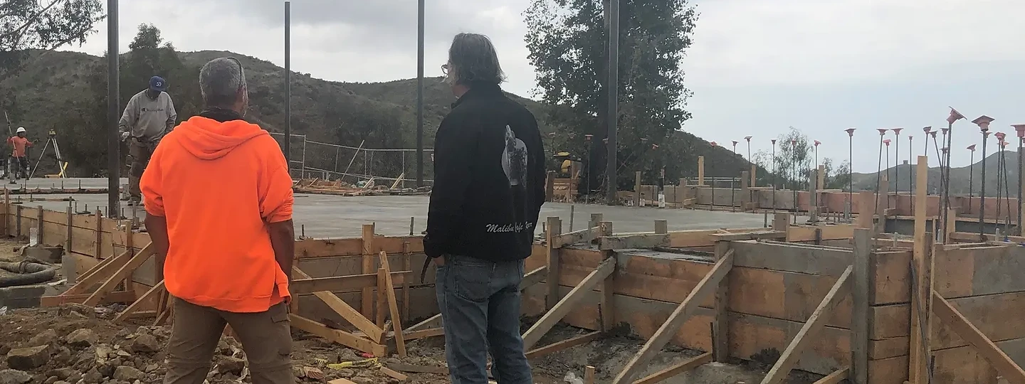 Reviewing formwork and steel columns on a foggy day