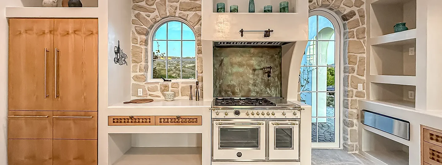 Range and copper backsplash in the kitchen at Mintcello
