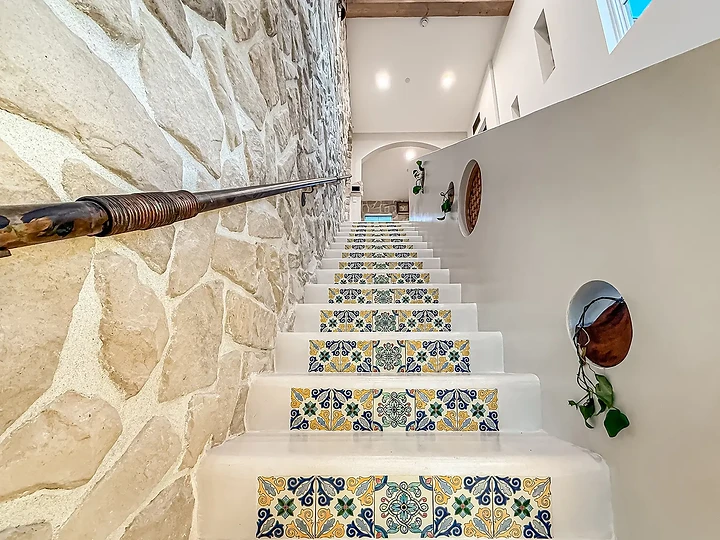 Stair with hand-painted tile risers at Mintcello