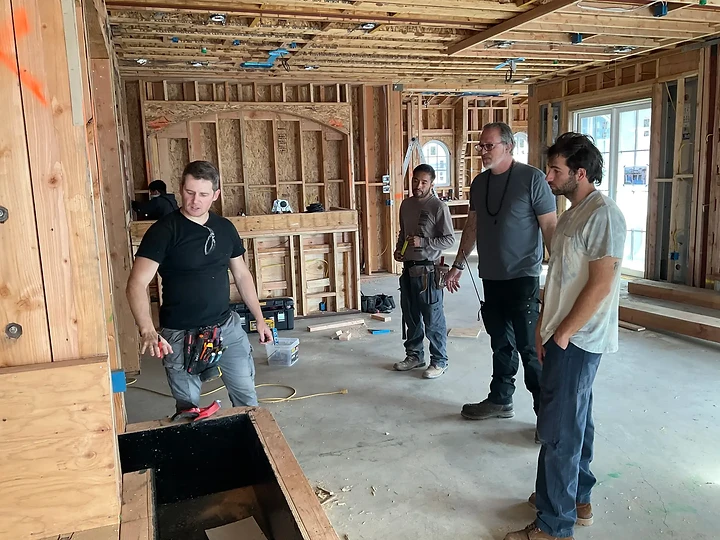 The team meeting inside a framed structure