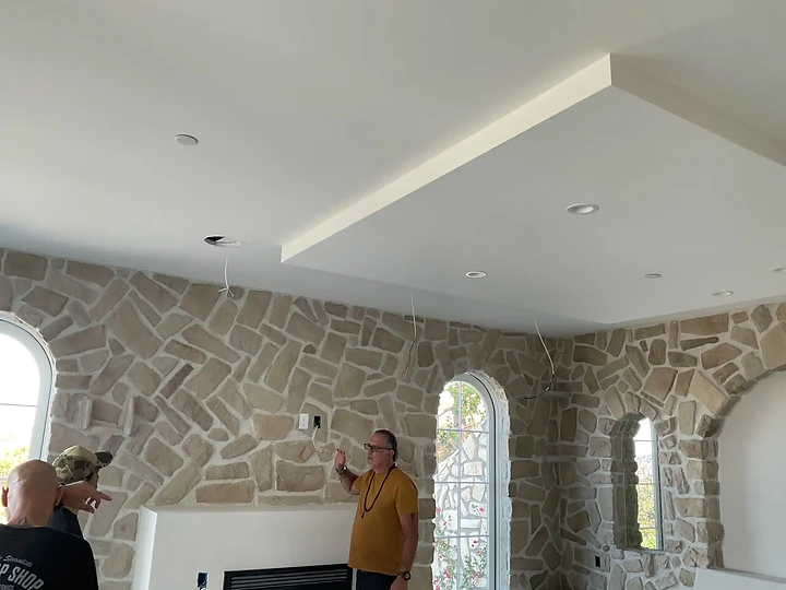 Walking a stone-walled interior during construction