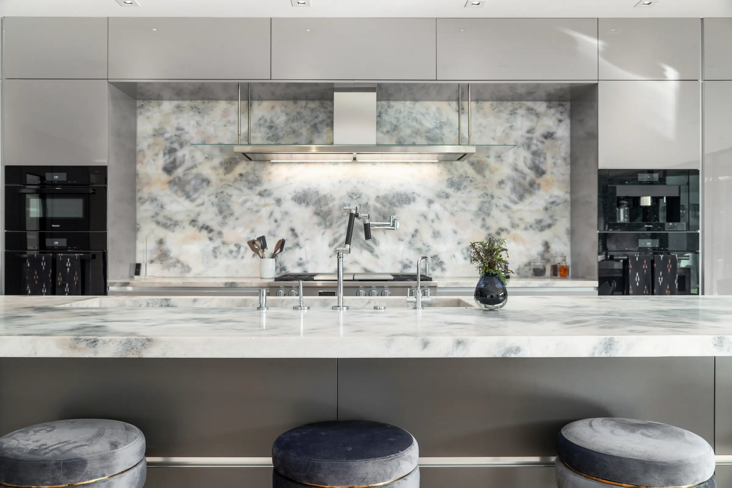 Stone kitchen and custom cabinetry in a luxury residence