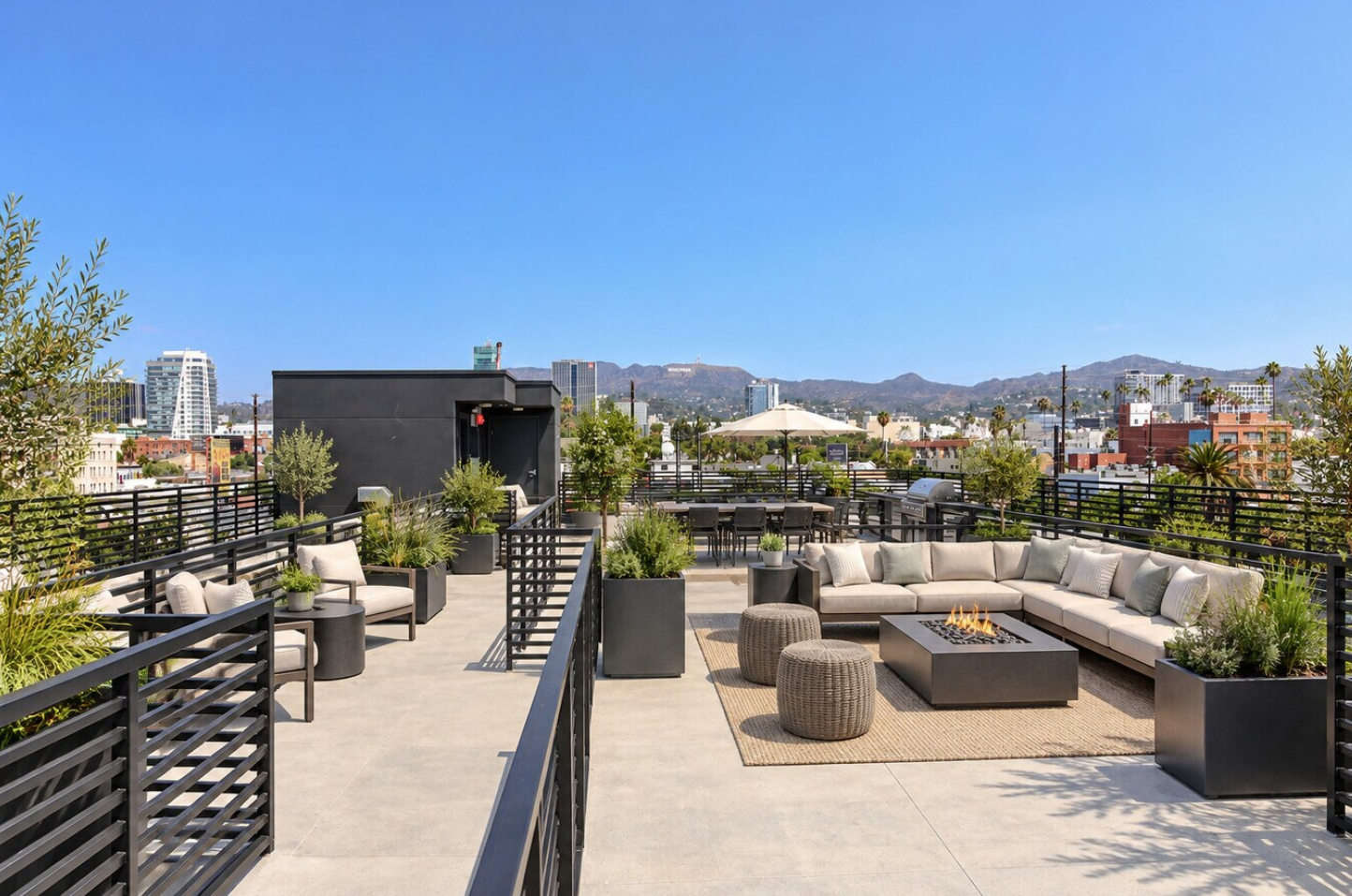 Roof terrace at Romaine Residences in Hollywood, with the Hollywood sign in the hills beyond, by Apel Design